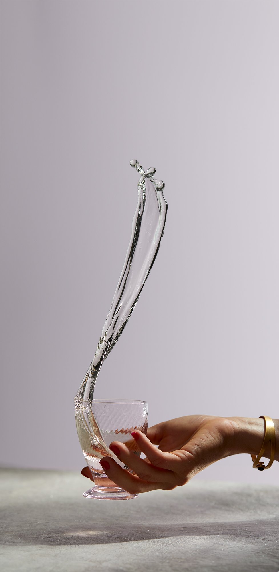 Wine pour before photo retouching